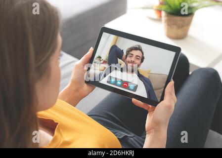 Young woman talking on video chat. Couple relationship. Stock Photo