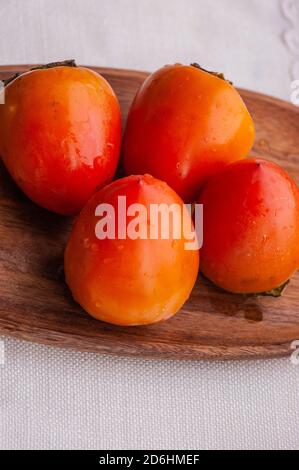 Persimmon fruit healthy food vitamins. Two persimmons Stock Photo