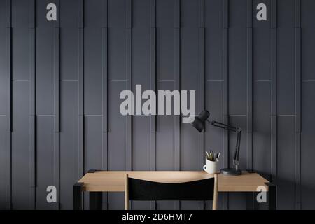 Modern workspace of working desk and blackwood wall. 3D rendering. Stock Photo