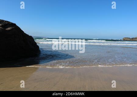 Surf waves on the sandy beach, Hayle, Cornwall, United Kingdom. 15/10/2020  surf waves on the golden sand Hayle beach in the sun Stock Photo