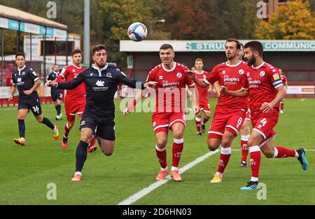 Morecambe’s Cole Stockton (left) battles for the ball with Crawley Town’s Jordan Tunnicliffe (centre), Jack Powell (right) and George Francomb (far right) during the Sky Bet League Two match at The People's Pension Stadium, Crawley. Stock Photo