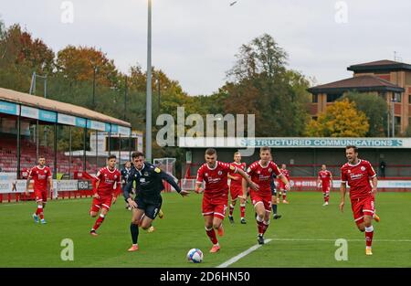 Morecambe’s Cole Stockton (left), Crawley Town’s Jordan Tunnicliffe (centre) and Crawley Town’s Jack Powell (right) battle for the ball during the Sky Bet League Two match at The People's Pension Stadium, Crawley. Stock Photo