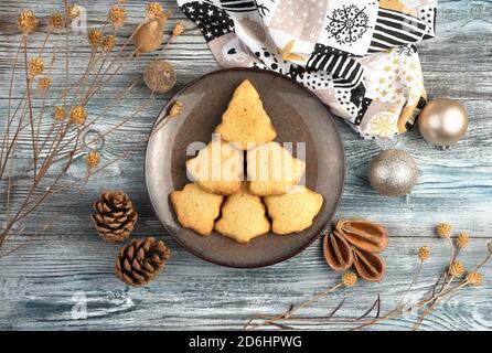 Christmas tree of cookies on a plate on a Christmas background. Stock Photo