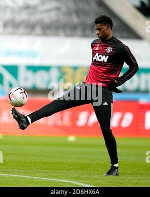 Manchester United's Marcus Rashford warms up prior to the Premier League match at St James' Park, Newcastle. Stock Photo