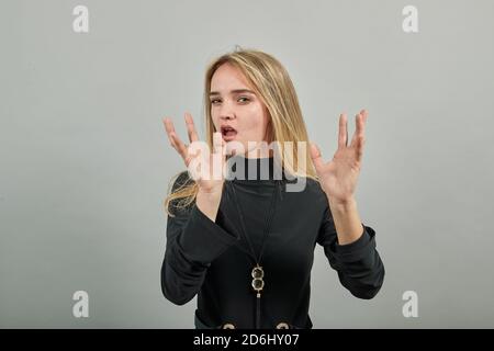 Attractive scowling angry, Head shot scowl, was offended gloomy eyebrows, Sulky, Waist-up portrait of beautiful face in displeasure, affront tensed, having bad mood, getting mad, frowning forehead Stock Photo