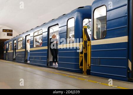 The metro train stopped at the station. The doors of the car are open and passengers are waiting for departure. Saint-Petersburg. Russia. October 17 2020 Stock Photo