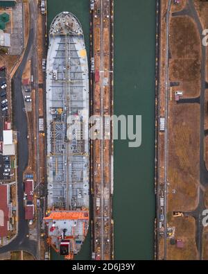Aerial view, cargo ship at the lock in the Panama Canal from above, Mirador Miraflores, Panama Stock Photo