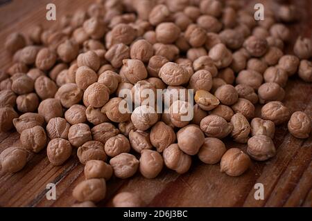 Chickpea grains on wooden background Stock Photo