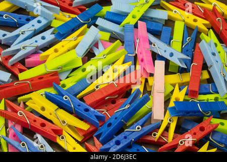 Colorful clothes pegs on the table Stock Photo