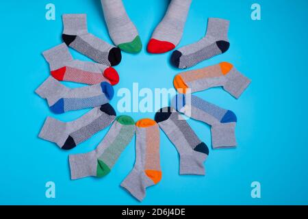 colored socks in a around on a blue background Stock Photo