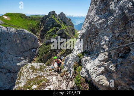 Young man climbing, via ferrata to the Seekarlspitze, 5-summit via ferrata, hike at the Rofangebirge, Tyrol, Austria Stock Photo