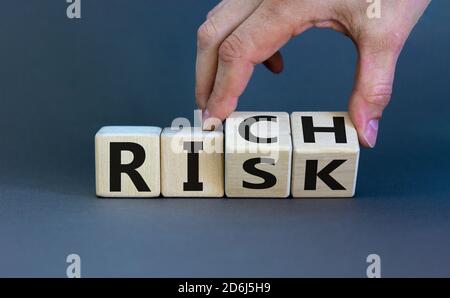 Take a risk and getting rich concept. Hand turns dice and changes the ...