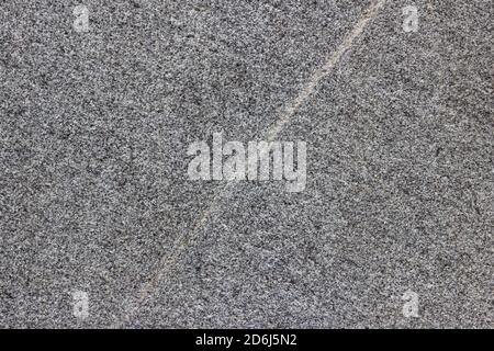 The texture of a natural stone slab from polished granite. Stock Photo