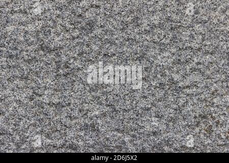 The texture of a natural stone slab from polished granite. Stock Photo