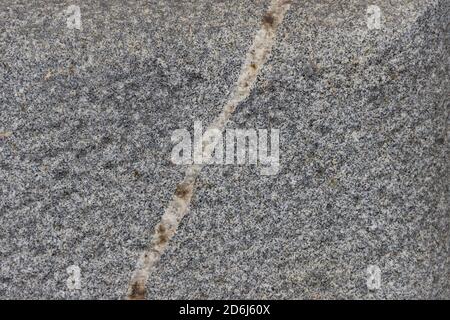 The texture of a natural stone slab from polished granite. Stock Photo