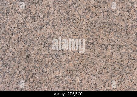 The texture of a natural stone slab from polished granite. Stock Photo