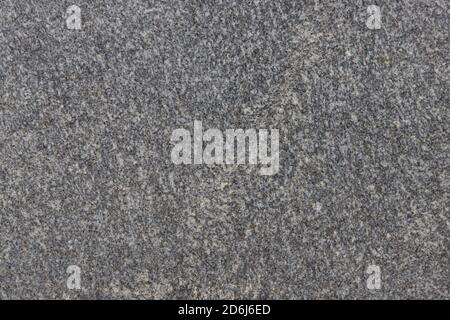 The texture of a natural stone slab from polished granite. Stock Photo