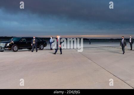 President Donald J. Trump walks across the tarmac after disembarking Air Force One at Des Moines International Airport Wednesday, Oct. 14, 2020, in Des Moines, Iowa. People: President Donald Trump Credit: Storms Media Group/Alamy Live News Stock Photo