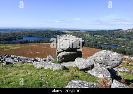 View from the top of Sheepstor, Dartmoor National Park, with open moorland, granite outcrop and Burrator Reservoir on a sunny day. Stock Photo