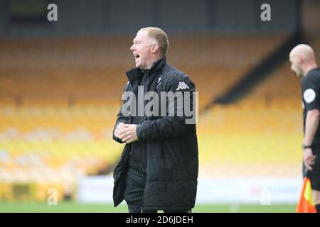 Burslem, Staffordshire, UK. 17th October, 2020. Salford City co-owner and interim manager Paul Scholes in the dugout as he takes charge of the team for the first time in the League Two fixture at Vale Park against Port Vale played behind closed doors due to the coronavirus pandemic. Salford City went on to lose the game 1-0. Stock Photo