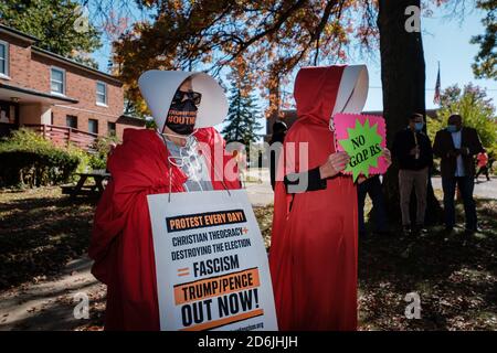 Cleveland, Ohio, USA. 17th Oct, 2020. Women dressed as handmaides display their signs while listening to speeches before an 'emergency women's march' Saturday, October 17, 2020 in Cleveland, Ohio. Credit: Andrew Dolph/ZUMA Wire/Alamy Live News Stock Photo