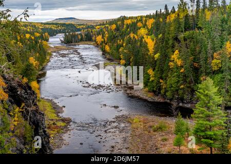 The gorge of the Kaministiquia River just downstream from the Kakabeka Falls with fall foliage color near Thunder Bay, Ontario, Canada.