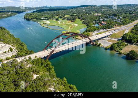 Gorgeous view of the Pennypacker bridge over the Colorado River. You can see the Austin Country Club and downtown Austin, TX in the background. Stock Photo