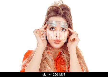 Shocked with shape of eye brows. Stylist woman measuring the eyebrows with the ruler looking up amazed surprised isolated on white. Micro-pigmentation Stock Photo