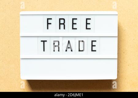 Lightbox with word free trade on wood background Stock Photo
