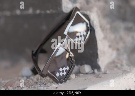 Black pixel sunglasses thug life with black lenses closeup. Selective focus Stock Photo