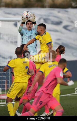 Madrid, Spain. 17th Oct, 2020. Real Madrid's goalkeeper Thibaut Courtois (Up) saves the ball during a Spanish football league match between Real Madrid and Cadiz CF in Madrid, Spain, on Oct. 17, 2020. Credit: Edward F. Peters/Xinhua/Alamy Live News Stock Photo