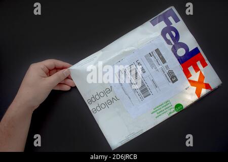 Calgary Alberta, Canada. Oct 17, 2020. A person with a Fedex package. Concept: shipping packages Stock Photo