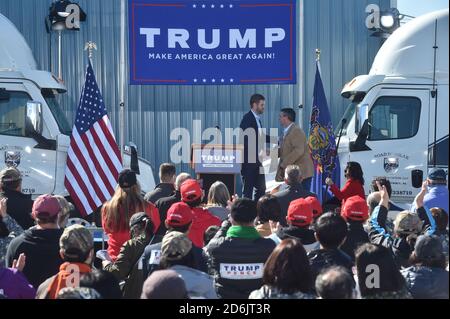 Dunmore, United States. 17th Oct, 2020. Eric Trump shaking hands with Jim Bognet who is running for the congress at the Road Scholar, Trucking company during the rally.Eric Trump speaks to approximately 400 people in Dunmore, PA, it's the city adjacent to Joe Biden's childhood home of Scranton. March of the audience was made up of a group called Japan 4 Donald Trump, as Eric Trump speaks of gun rights and Amy Coney Barrett. Credit: SOPA Images Limited/Alamy Live News Stock Photo