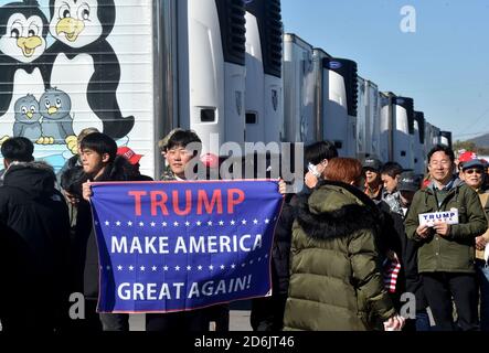 Dunmore, United States. 17th Oct, 2020. A supporter holding a Trump banner at the Road Scholar, Trucking company during the rally.Eric Trump speaks to approximately 400 people in Dunmore, PA, it's the city adjacent to Joe Biden's childhood home of Scranton. March of the audience was made up of a group called Japan 4 Donald Trump, as Eric Trump speaks of gun rights and Amy Coney Barrett. Credit: SOPA Images Limited/Alamy Live News Stock Photo