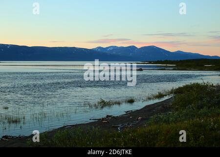 Light summer night at lake Tornetrask in northern Sweden Stock