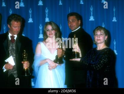 Los Angeles, California, USA 25th March 1996 Makeup Artist Peter Frampton, Actress Alicia Silverstone, makeup artist Paul Pattison and makeup artist Lois Burwell pose with their oscars for Makeup for Film Braveheart at the 68th Annual Academy Awards at Dorothy Chandler Pavilioin on March 25, 1996 in Los Angeles, California, USA. Photo by Barry King/Alamy Stock Photo Stock Photo