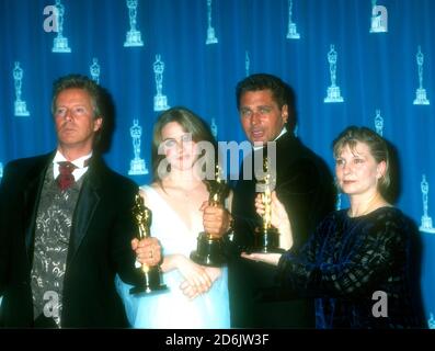Los Angeles, California, USA 25th March 1996 Makeup Artist Peter Frampton, Actress Alicia Silverstone, makeup artist Paul Pattison and makeup artist Lois Burwell pose with their oscars for Makeup for Film Braveheart at the 68th Annual Academy Awards at Dorothy Chandler Pavilioin on March 25, 1996 in Los Angeles, California, USA. Photo by Barry King/Alamy Stock Photo Stock Photo
