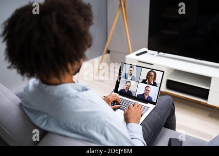 Man In Video Conferencing Call On Laptop. Webinar Conference Stock Photo