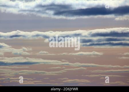 Pastel colored cumulus clouds in northern Sweden. Stock Photo