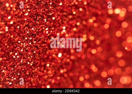 Sparkle red texture, Christmas background. Glitter textile surface. Abstract pattern. Festive abstraction. Shiny fabric with sequins. Holiday art desi Stock Photo