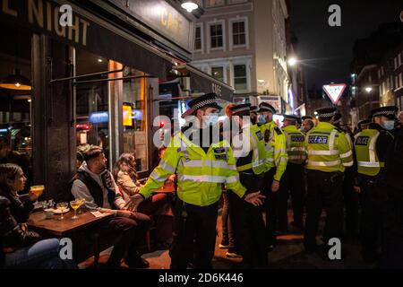 Police on patrol on Old Compton Street during what is perciebved as the Last Night of Freedom as Tier 2 Lockdown is enforced on gatherings at restaurants and bars in Soho, London, UK Credit: Jeff Gilbert/Alamy Live News Stock Photo