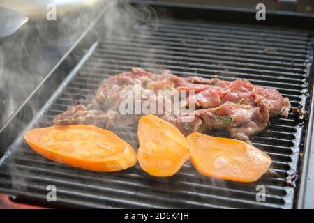 Grilled slices of sweet potato and Beef Ribeye meat