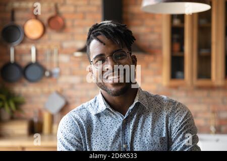 Headshot portrait of smiling African American man in glasses Stock Photo