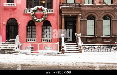 typical new york city street in snowy storm with christmas vibes