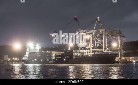 Tivoli, Cork, Ireland. 18th October, 2020. Container ship Samskip Endeavour offloading her cargo durning the night at Tivoli Docks in Cork City, Ireland. - Credit; David Creedon / Alamy Live News Stock Photo