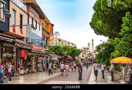 Everyday life in Kusadasi, Turkey as tourists shop in local stores along a crowded street Stock Photo