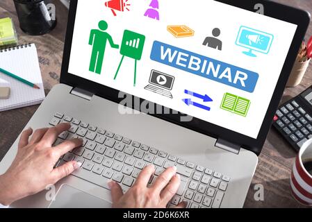 Webinar concept shown on a laptop screen Stock Photo