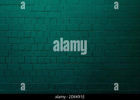 Petrol brick wall background with shades of light and dark teal