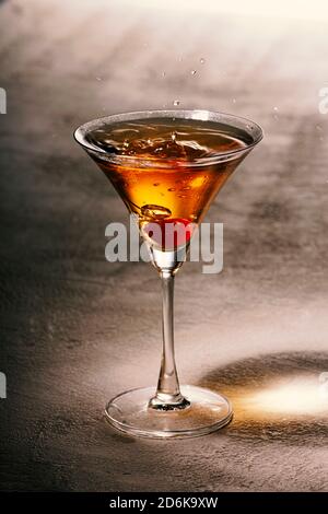 Alcoholic drink with ice on a light table, close up Stock Photo