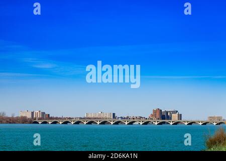 MacArthur bridge over Detroit river and city view on sunny day from sunset point of Belle Isle Stock Photo